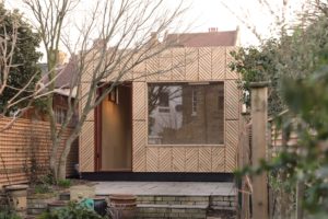 U-Build can be used for bespoke projects. This is a close up exterior photograph of a garden room in an East London garden