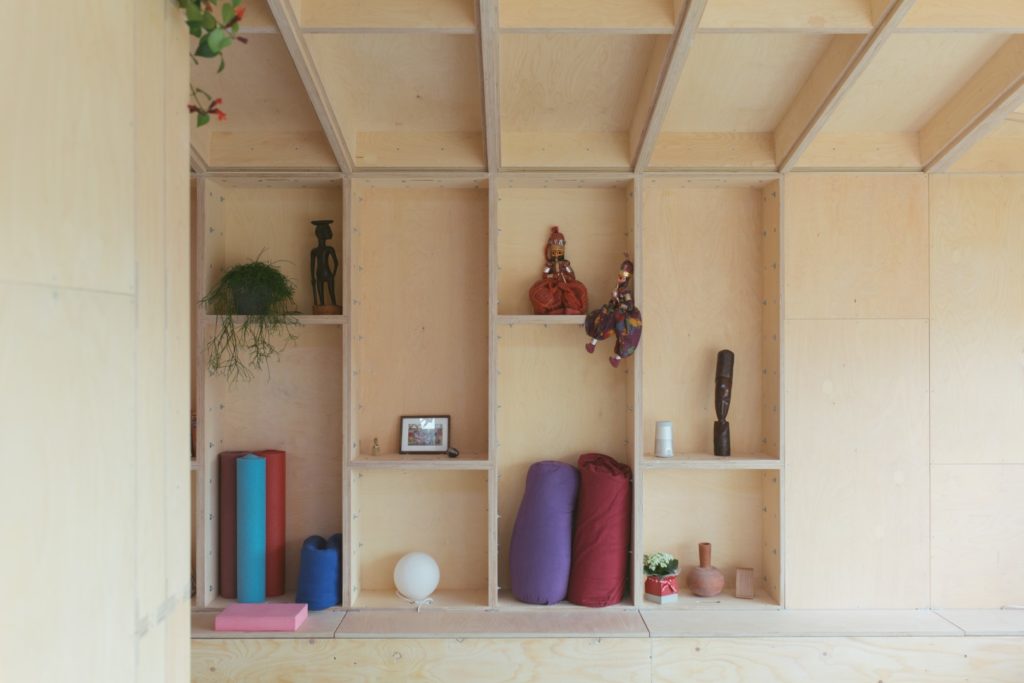 A built in wooden wall storage inside a U-Build house