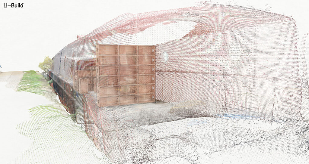 A digital point cloud rendering shows the exterior and interior structure of the canal boat, including stacked wooden U-Build boxes and partial outlines of walls and roof—evoking a floating gallery installation, with sparse vegetation left. The Li-Build logo appears in the corner.